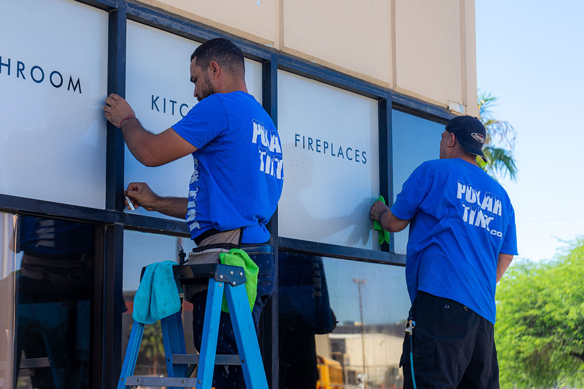 Custom door logo and cut-vinyl decals on a Parker vehicle, professionally weeded and installed